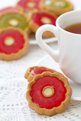 Cup of tea and colorful cookies