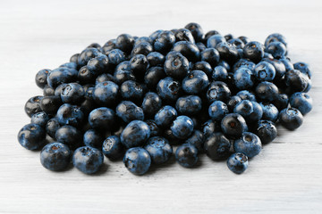 Fresh blueberries on wooden table close up