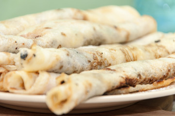 Pancakes topped with chocolate cream in shallow focus