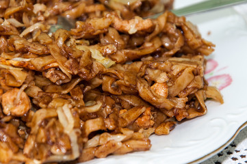 Chinese food noodles with chicken meat and cabbage