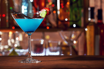 Glass of cocktail on the bar counter