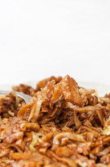 Chinese food chicken meat on the fork in focus