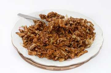 Chinese food chicken meat on the fork in focus