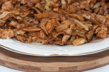 Chicken meat with cabbage and pastry