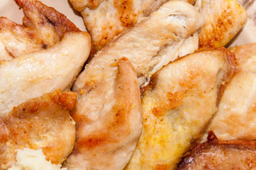 Pile of grilled chicken breasts