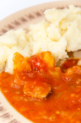 Top view chicken meat mashed potato tomato stew