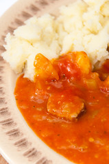 Top view chicken meat mashed potato tomato stew