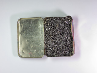 An old tin box, full of Shoe nails