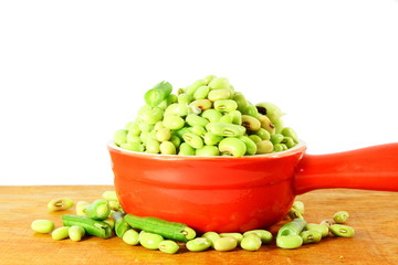 fresh green Black eye peas beansout of the shell in white background