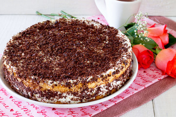 Cake, cheese souffle and cream on a white wooden table