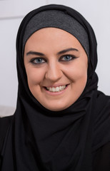 Smiling arabic woman wearing hijab