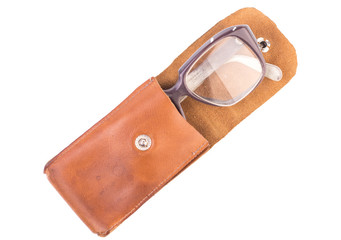 old glasses in a leather case, isolated