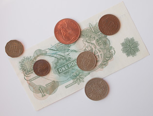 one Sterling Pound note, circa 1970, and coins