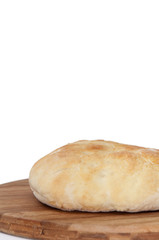 Domestic flat bread on a wooden board