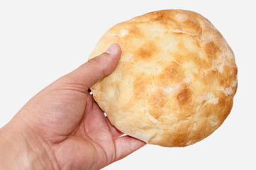 Hot domestic bun in hand