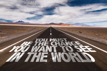 You Must Be the Change You Want to See in The World written on desert road