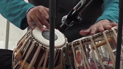 Indian man playing Indian musical instruments Tabla Punjabi drums
