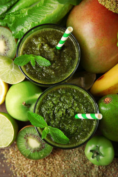 Green healthy juice with fruits and vegetables close up