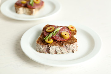 Tasty sandwiches on plates, close up