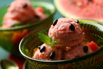 Watermelon ice cream in bowl  on color wooden background