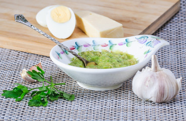 Avocado paste with egg, cheese and garlic