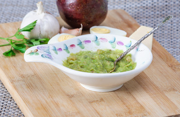 Avocado paste with egg, cheese and garlic