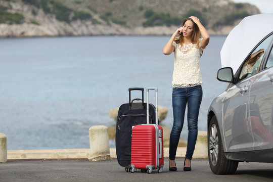 Worried Traveler Woman Calling Assistance With A Breakdown Car