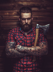 Brutal man with beard and tattooe.