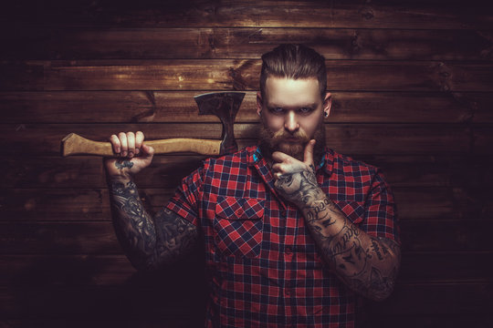 Brutal man with beard and tattooe.