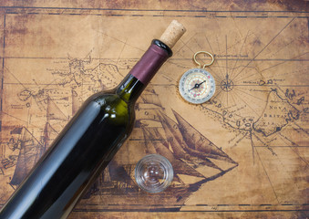 bottle of wine  on the background of old maps