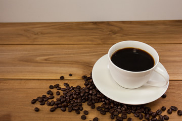 Cup of coffee on an old wooden table