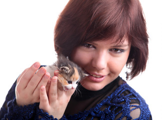 brunette short-haired girl in lace dress holds kitten