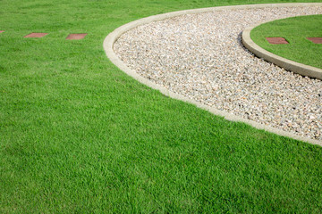 field green grass and white stone