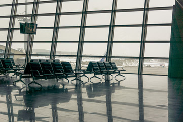 airport waiting area seats and window 