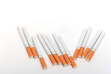 Arranged in a row cigarettes. Over background.