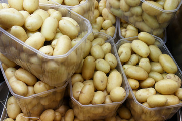 raw potatoes on pot