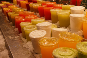 fruit pots and juice at the Boqueria market in Barcelona