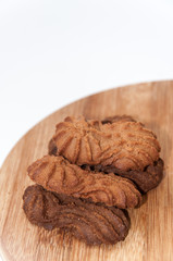 Brown chocolate cookies on the wooden board