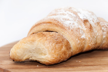 Puff pastry with fruit jam on the wooden board