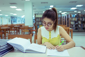 study education, woman writing a paper, working women