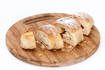 Puff pastry sliced on the wooden board
