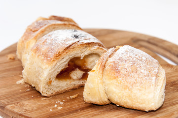 Puff pastry sliced on the wooden board