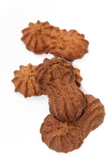 Brown chocolate cookies over white background