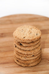 Pile of integral biscuits on a wooden board