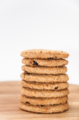 Fototapeta na wymiar Pile of integral biscuits on a wooden board