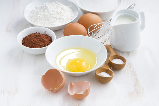 fresh ingredients for baking on a white table, horizontal