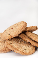 Pile of integral biscuits over white background
