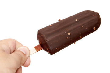 Chocolate ice cream on a stick in hand