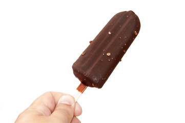Chocolate ice cream on a stick in hand