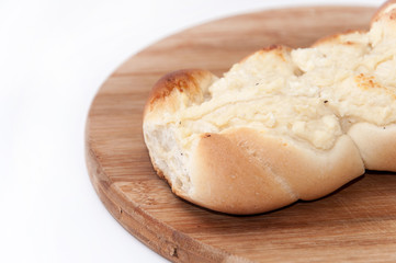 Pastry stuffed with cheese on the wooden board